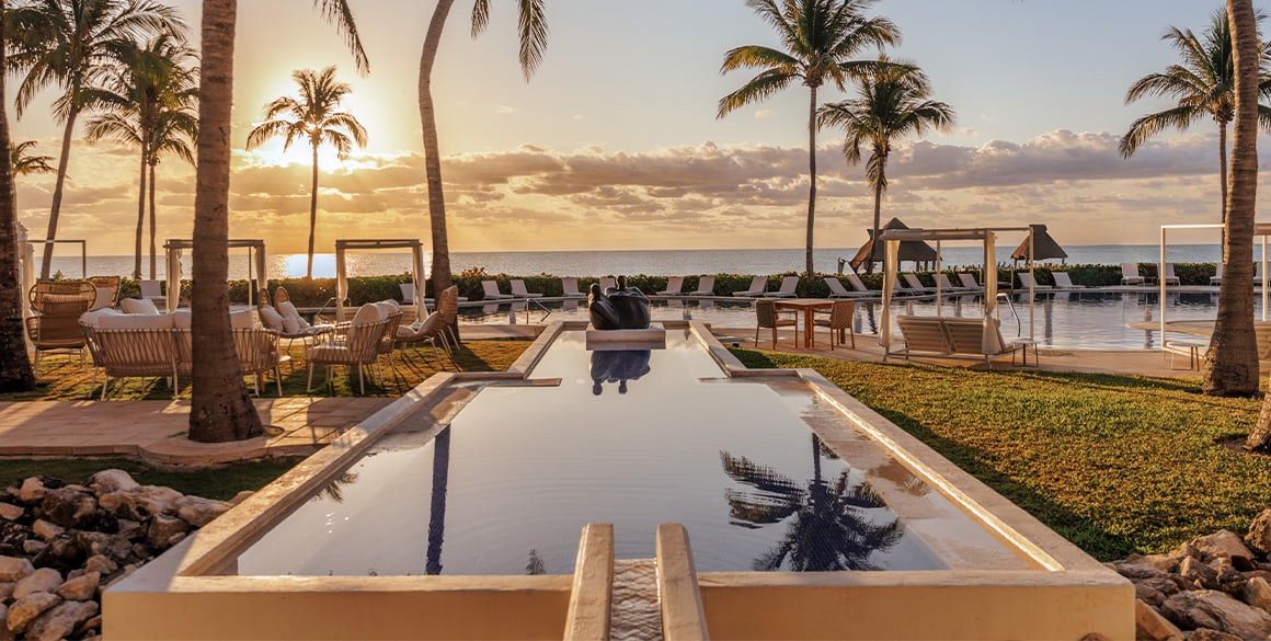 Infinity edge pool in the sunset at Paraiso de la Playa Bonita