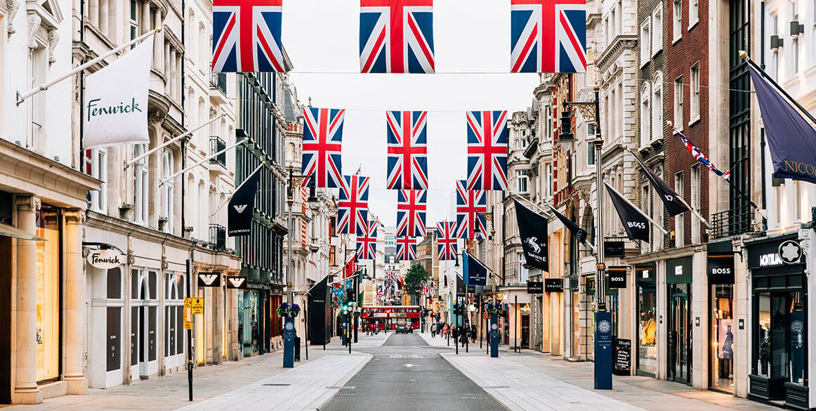 Street in London with Union Jack flags hanging overhead