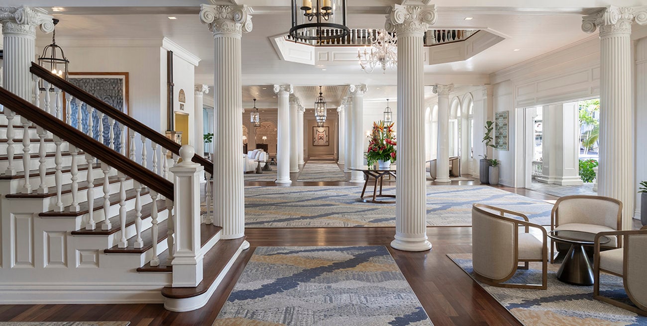 Grand colonial entryway with columns and staircase