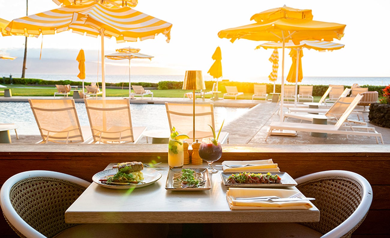 Elevated forest green residential building on a wide lawn