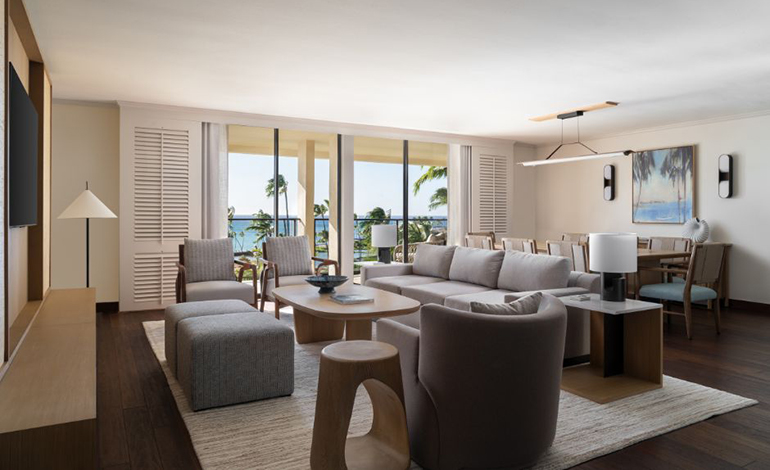 Contemporary living room with communal seating and a large dining table 