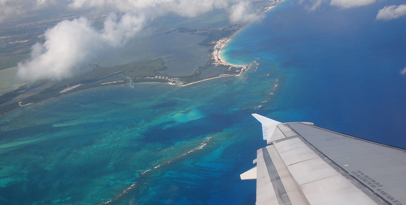 Aerial view of Cancun from the wing of a plane