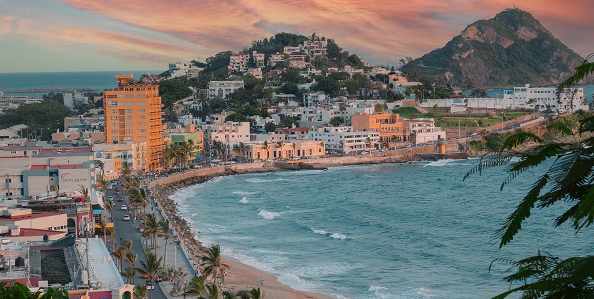 Aeiral sunrise view of the protected cove of Mazatlan with mountains in the background