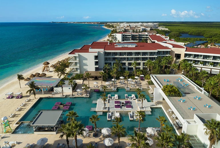 Aerial view of a resort in the Caribbean and its square pools