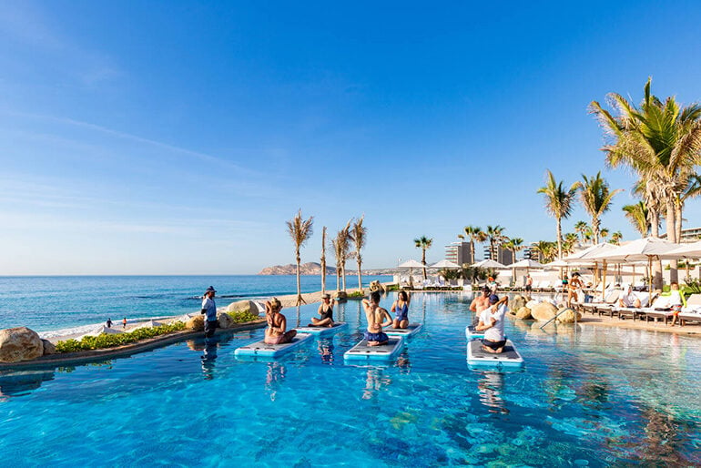 A yoga class in the pool at Villa la Valencia Beach Resort & Spa Los Cabos