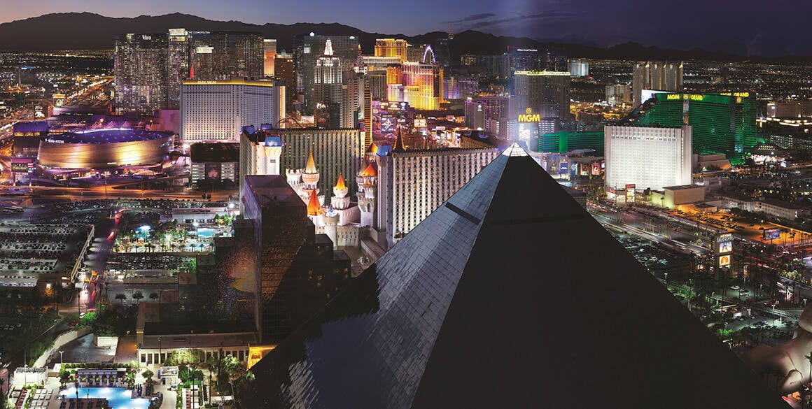 Aerial evening photo of the Las Vegas Strip with a black pyramid in the foreground