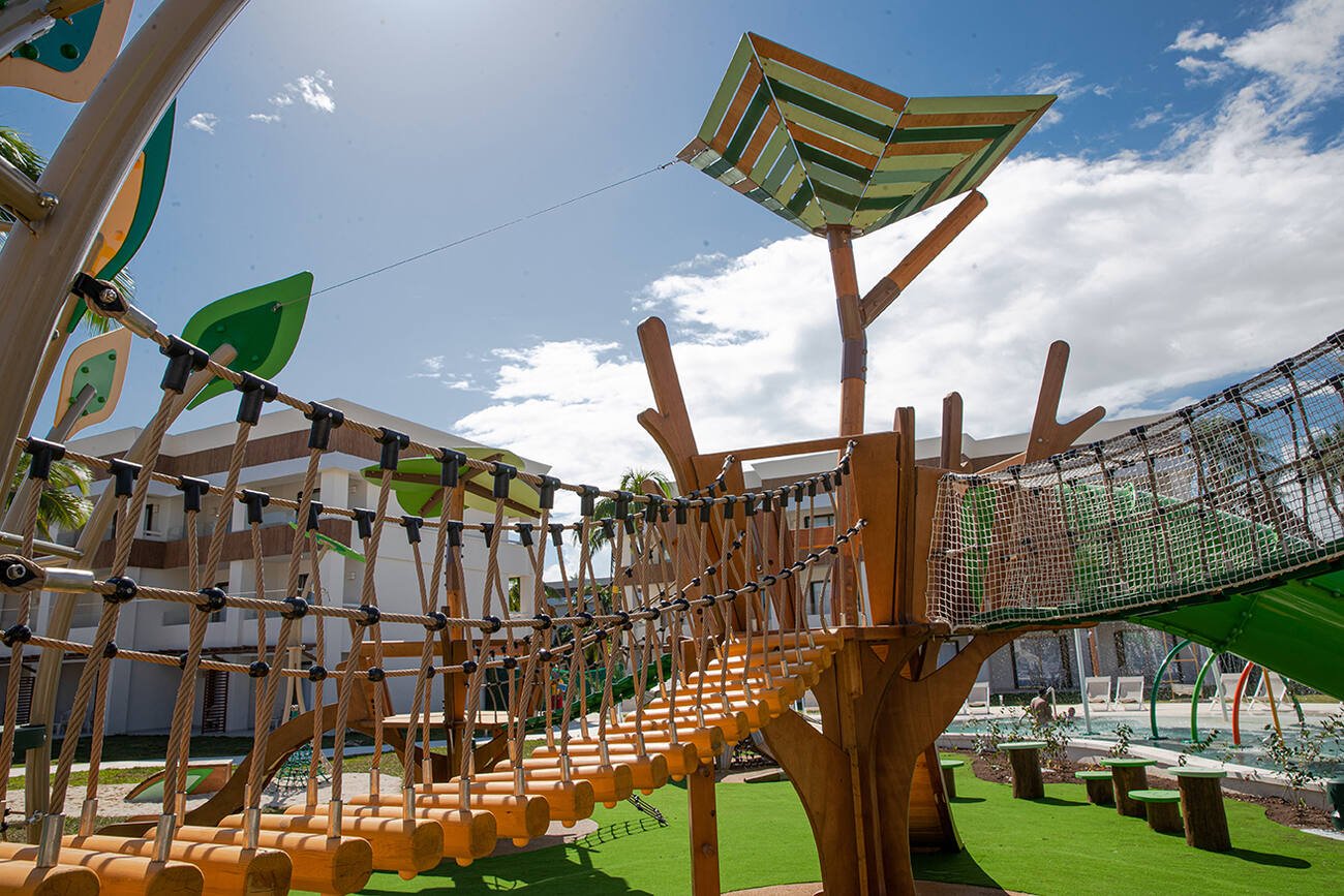 Kids outdoor play area with a bridge to a tree like play set