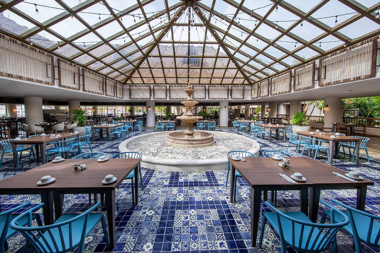 Dining tables set up around a fountain