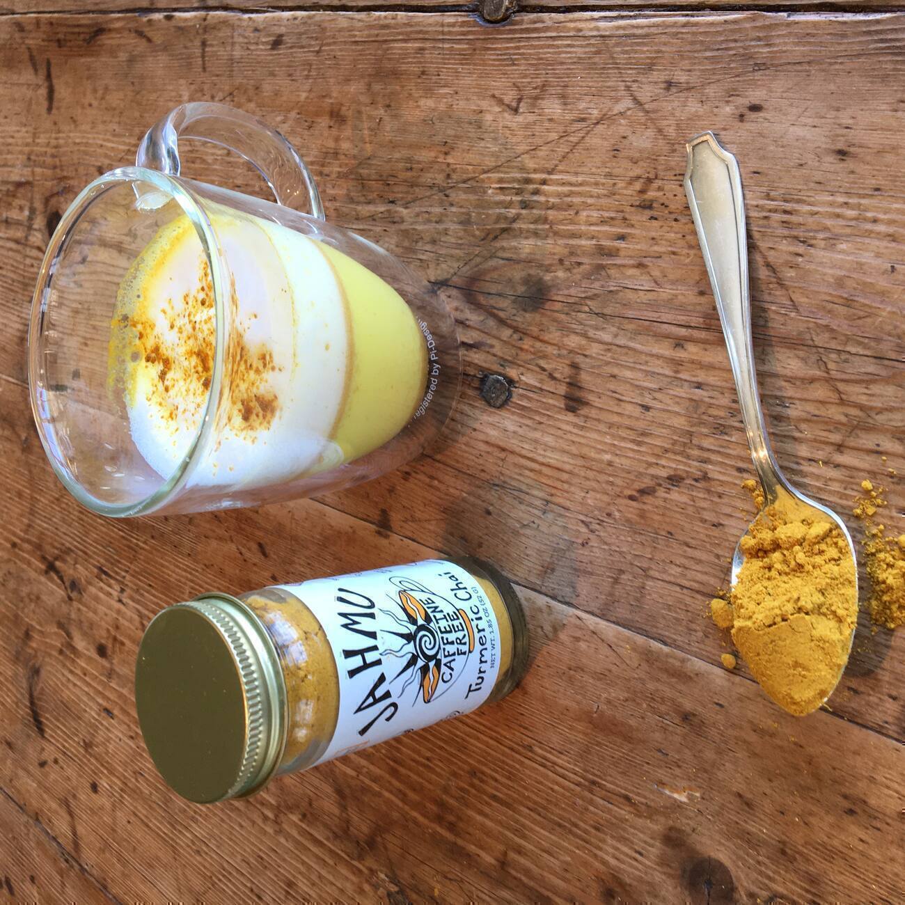 Jar of turmeric chai and a mug with it made