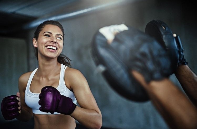 Woman boxing with another person