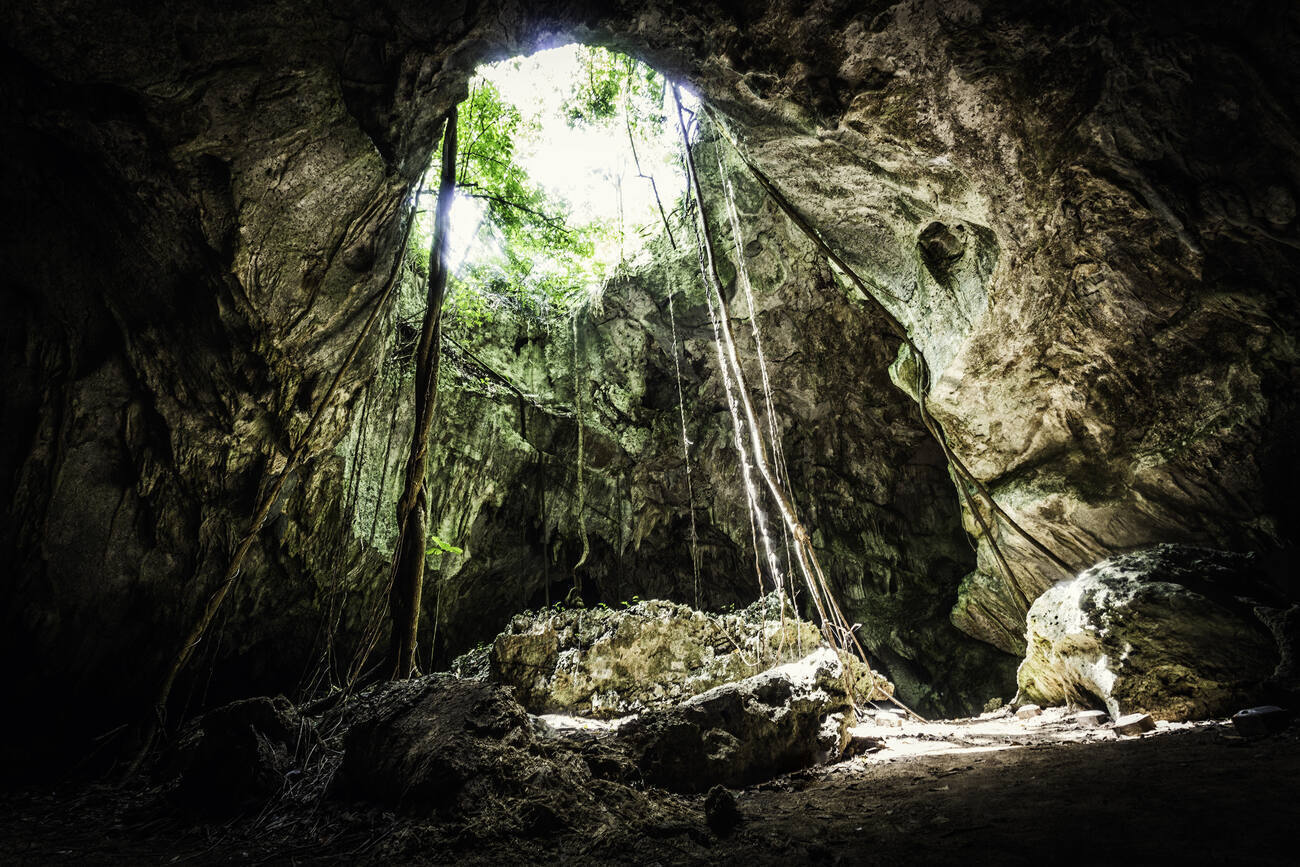 An underground cavern with an open ceiling.