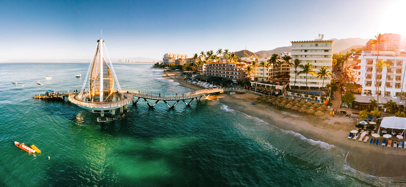 A sailboat-shaped pier connects to the Malecon boardwalk in Puerto Vallarta.