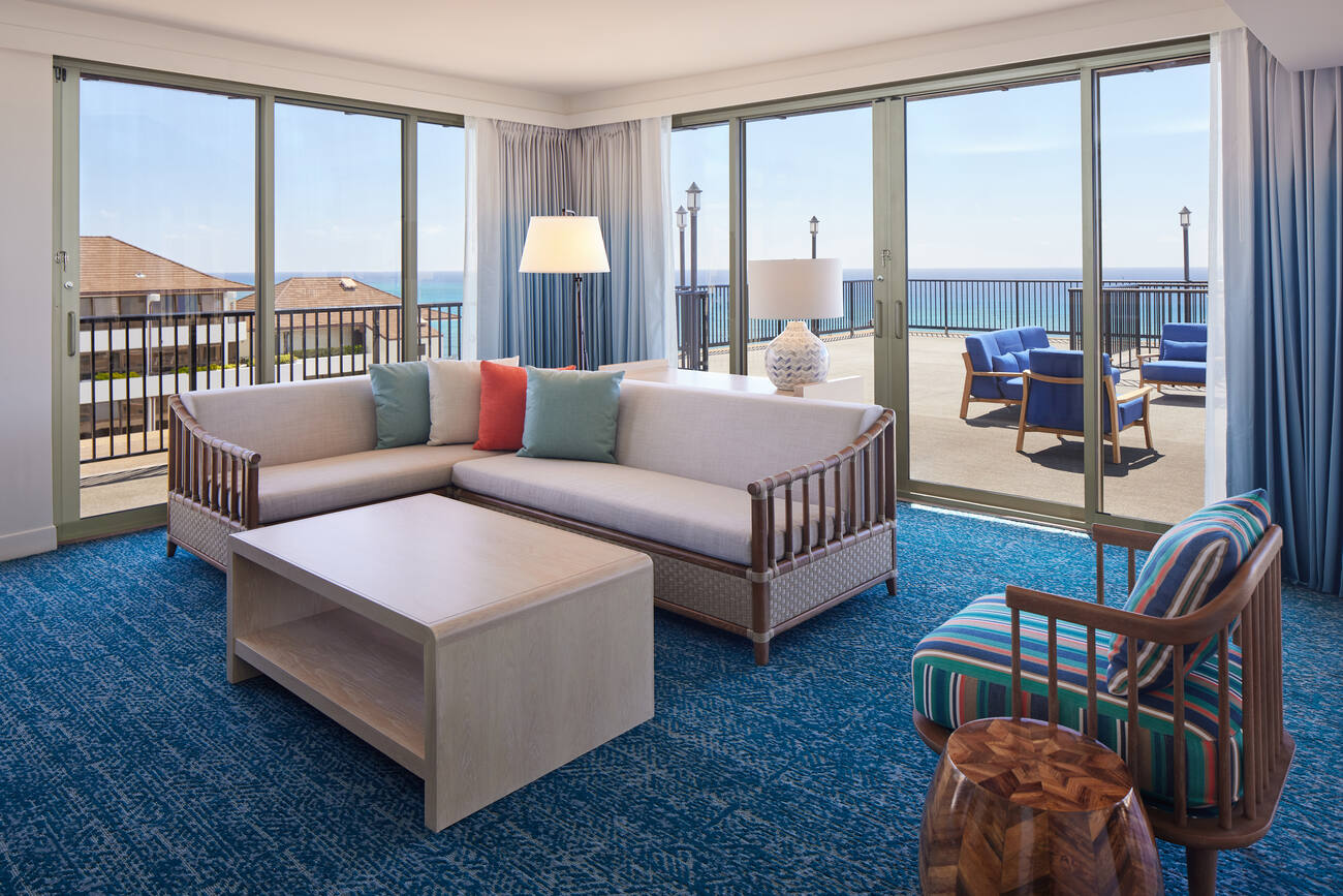 Hotel living room and patio with ocean view