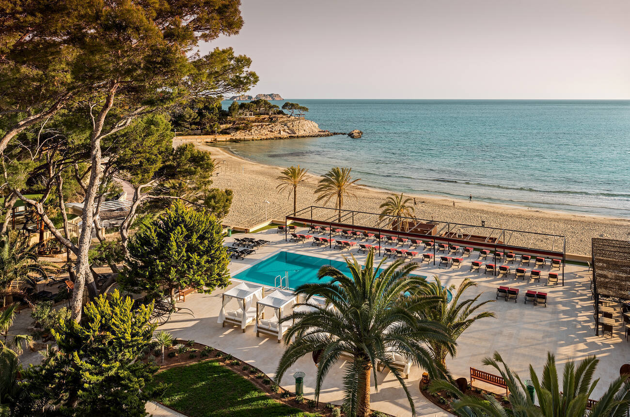 Beachfront pool with covered and uncovered lounge chairs