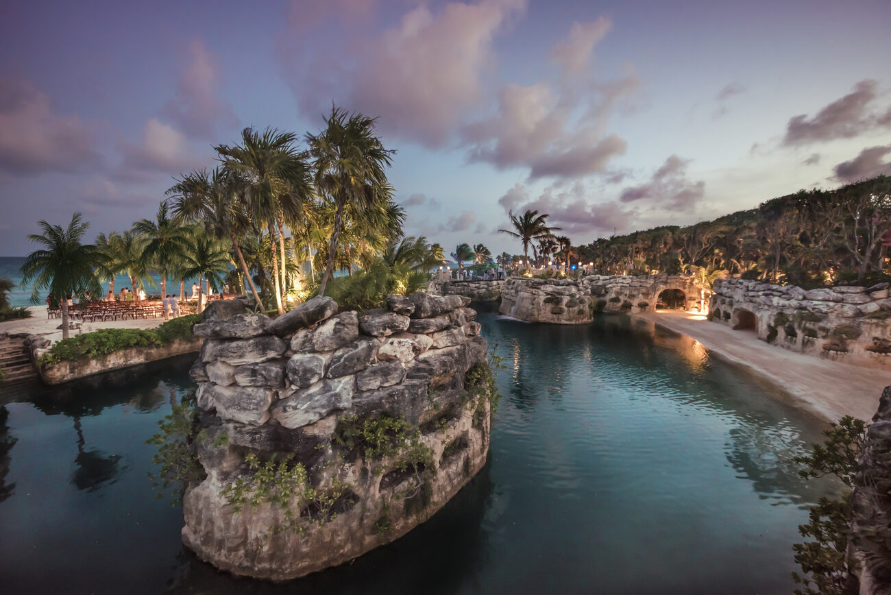 Lit up pathway to rocks overlooking the ocean