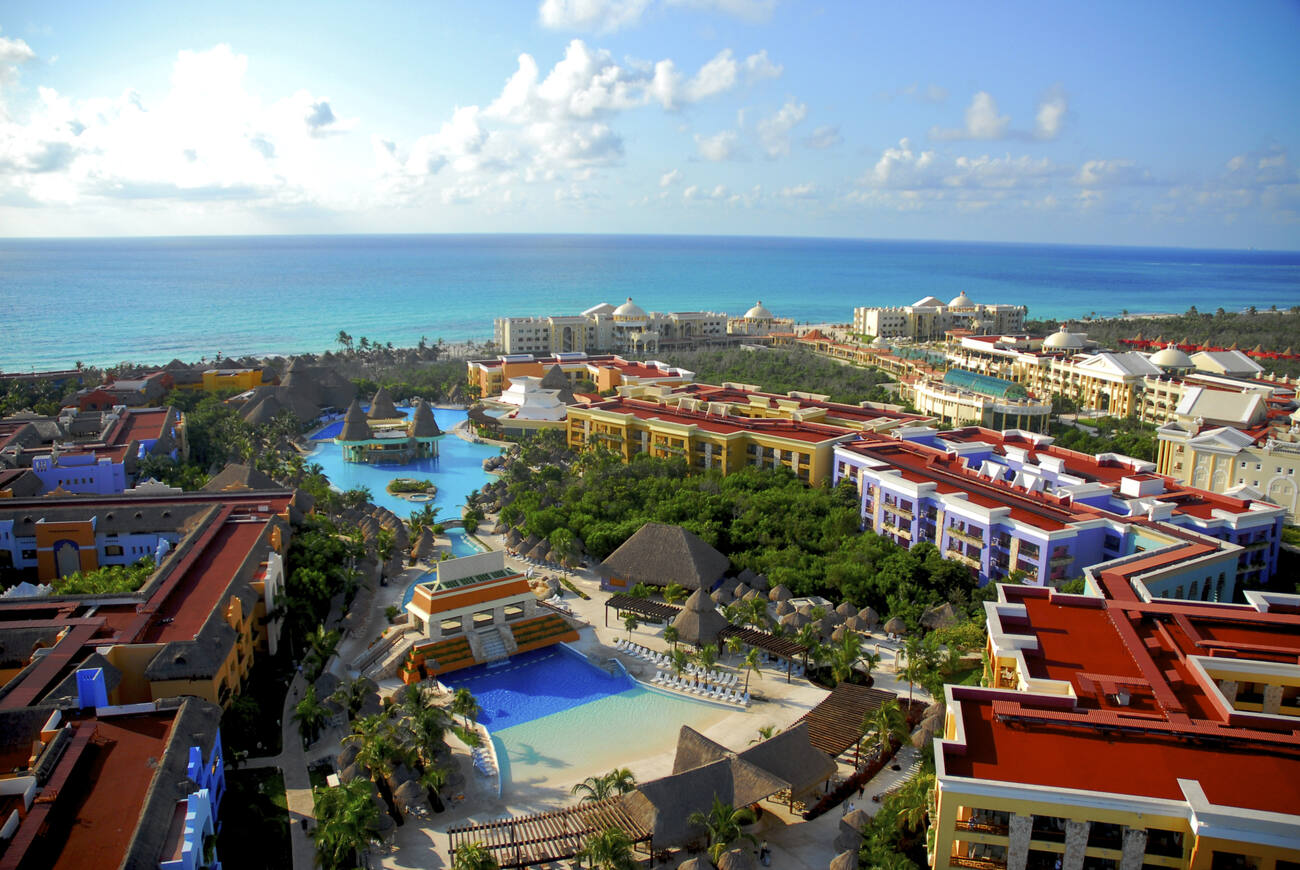 Ariel view of hotels, pools, and ocean