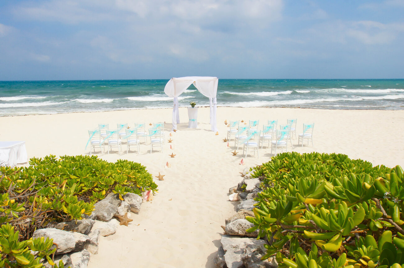 Beach wedding alter and seating with starfish and shells