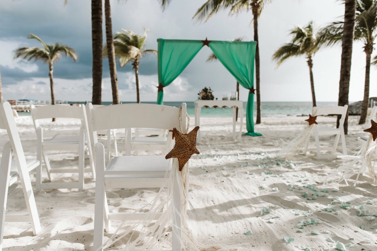 Wedding seating on the beach with a starfish on the chair