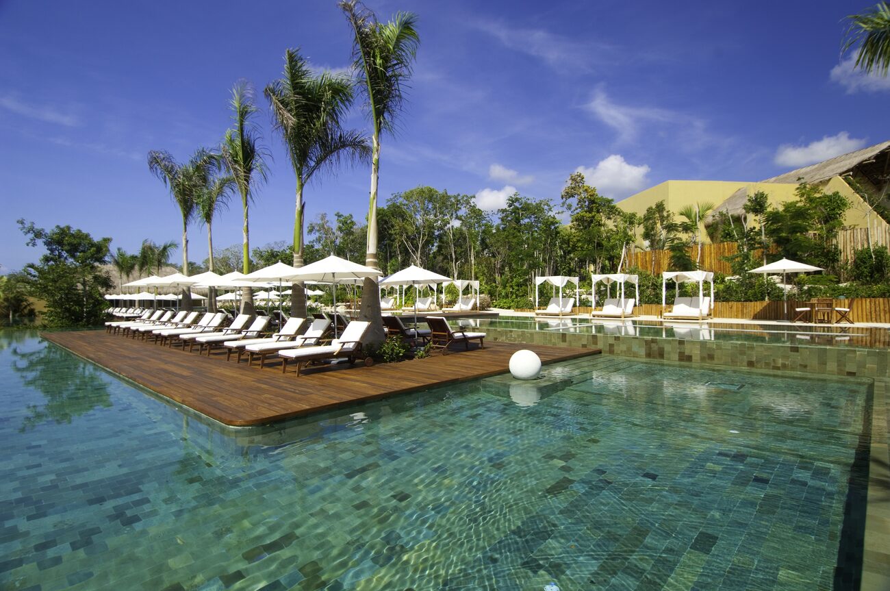 Pool with covered and uncovered lounge chairs