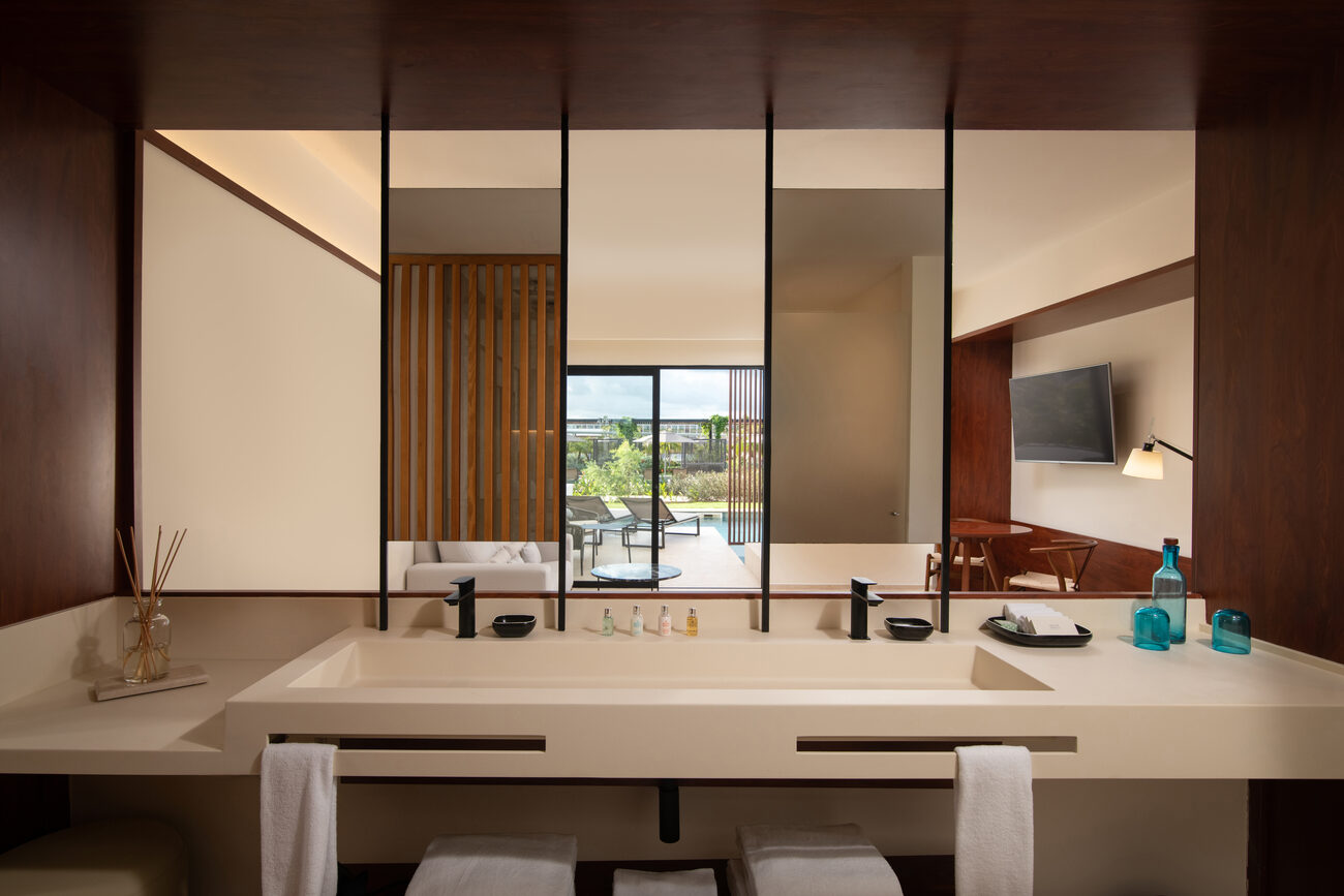 Bathroom sinks looking out onto the resort