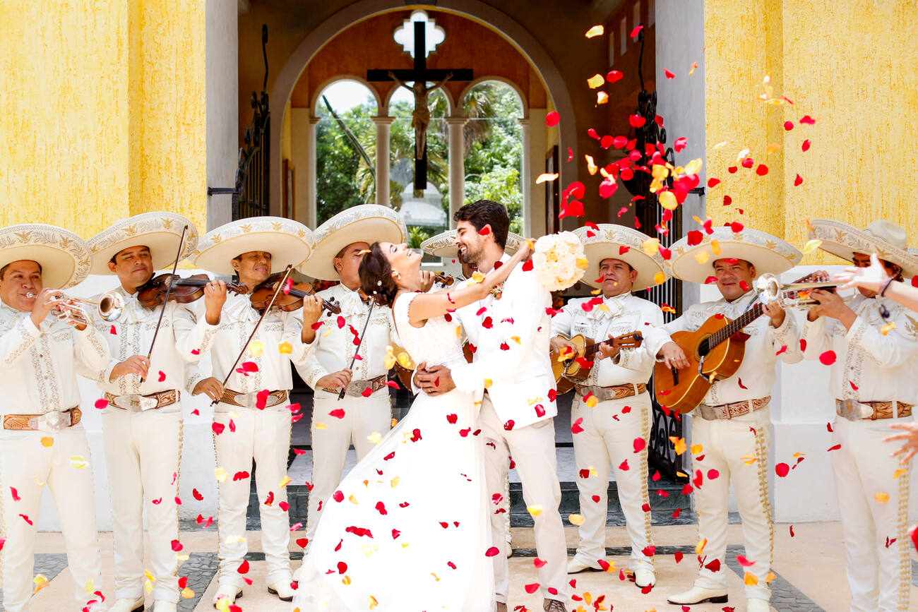 Couple dancing with a Mariachi band performing 