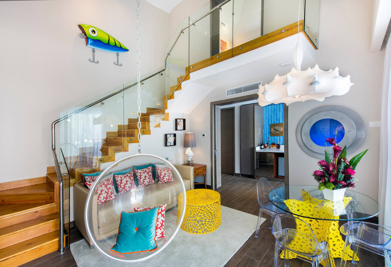 Nickelodeon hotel room with staircase leading to second floor