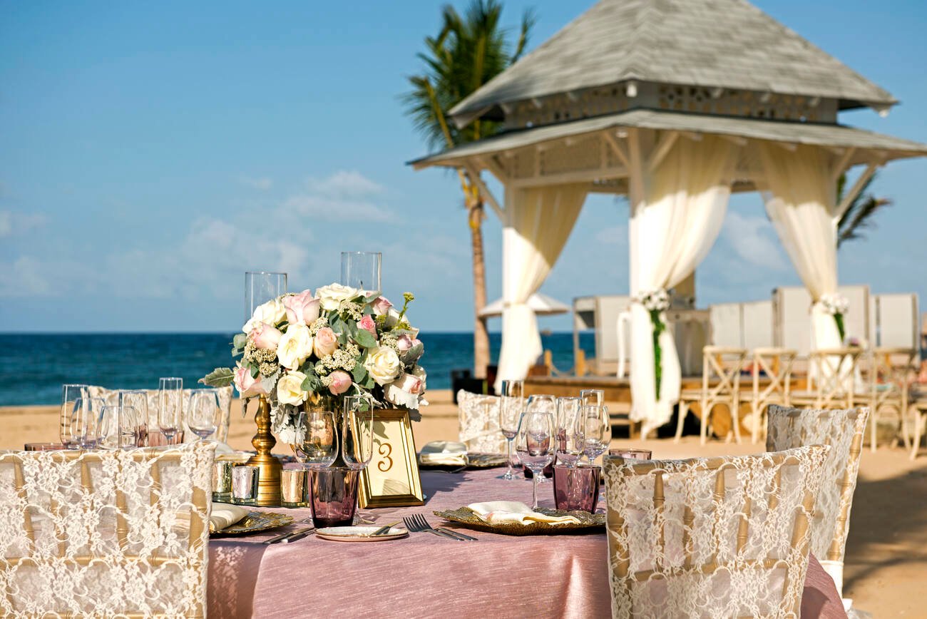 Beach wedding dining tables set up