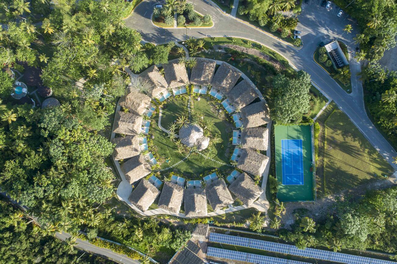 Arial view of bungalows and tennis court