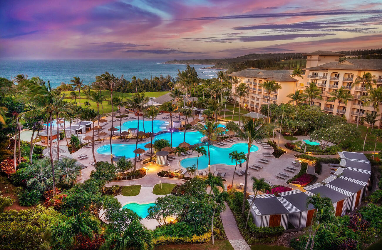 View of hotel, pools, and ocean