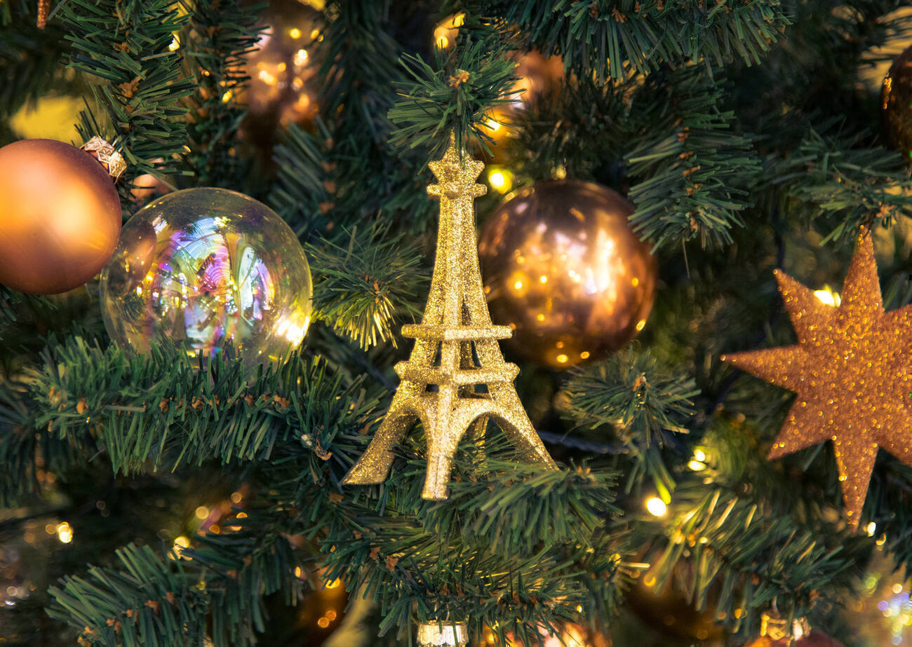 Ornaments on a tree including an Eiffel Tower 