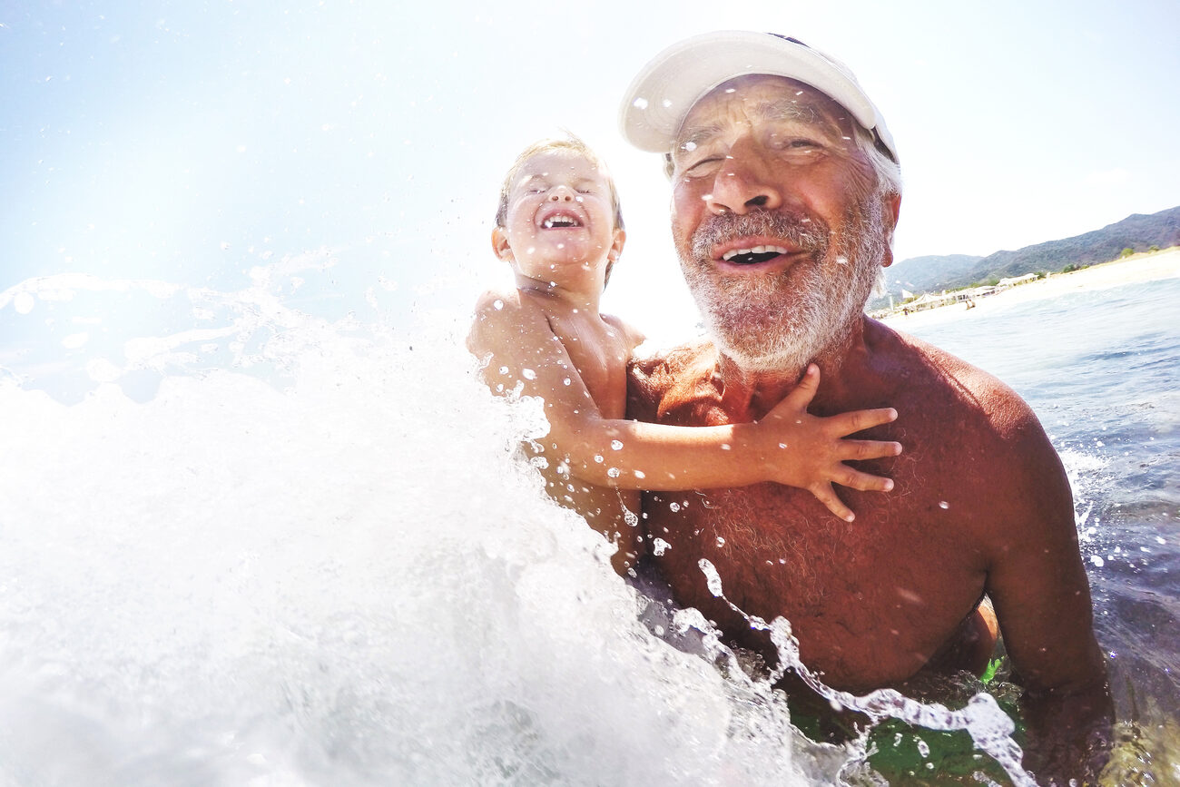 Man and child in the ocean