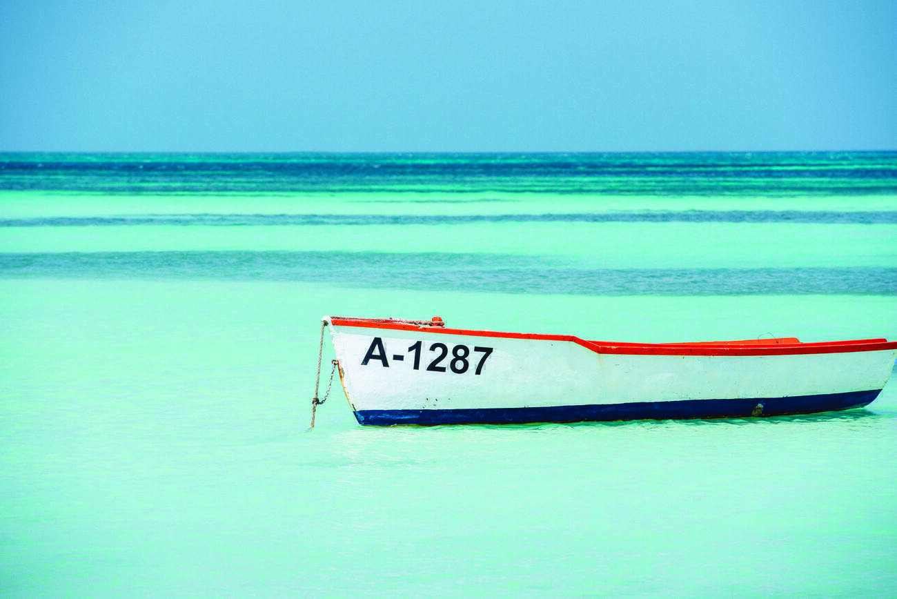 Small boat anchored in the ocean