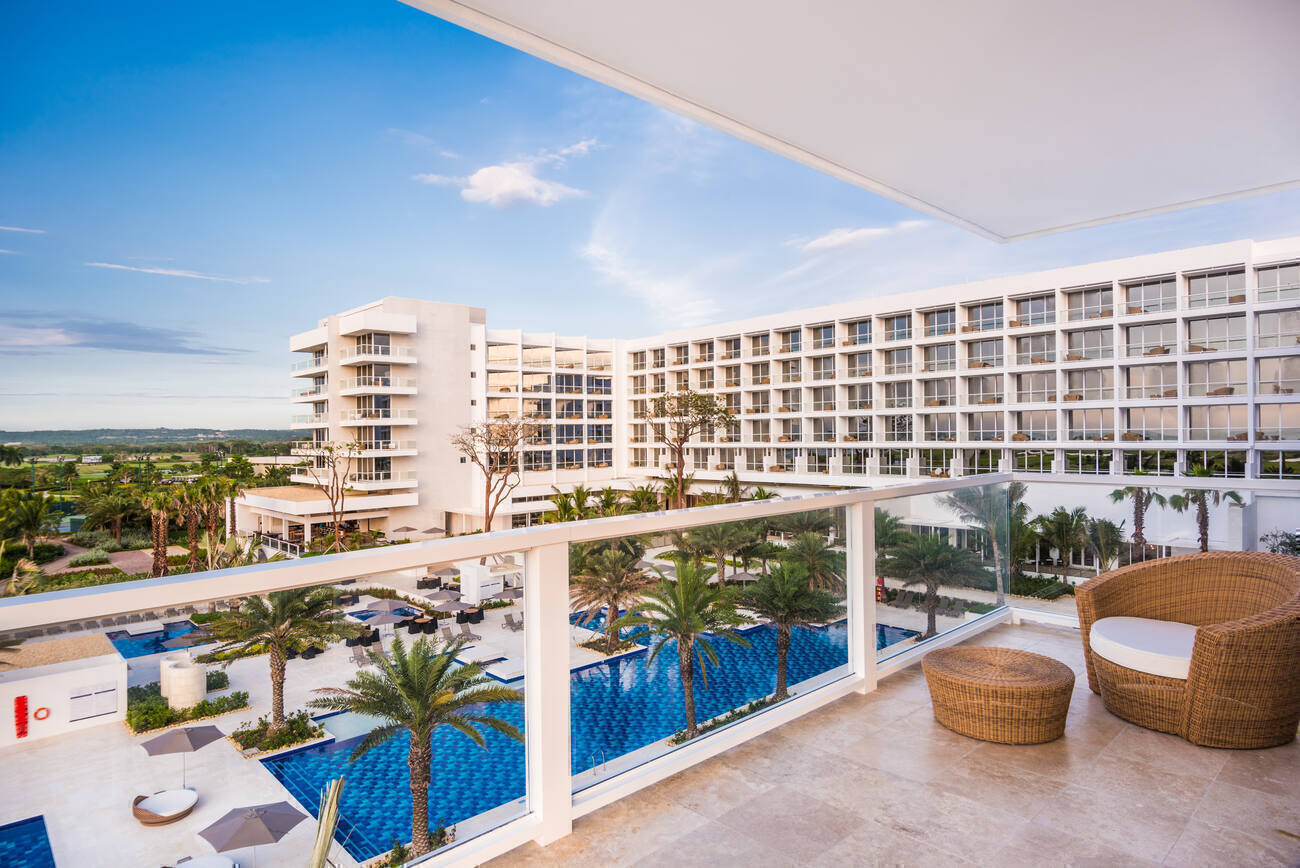 Balcony view of the hotel and pools