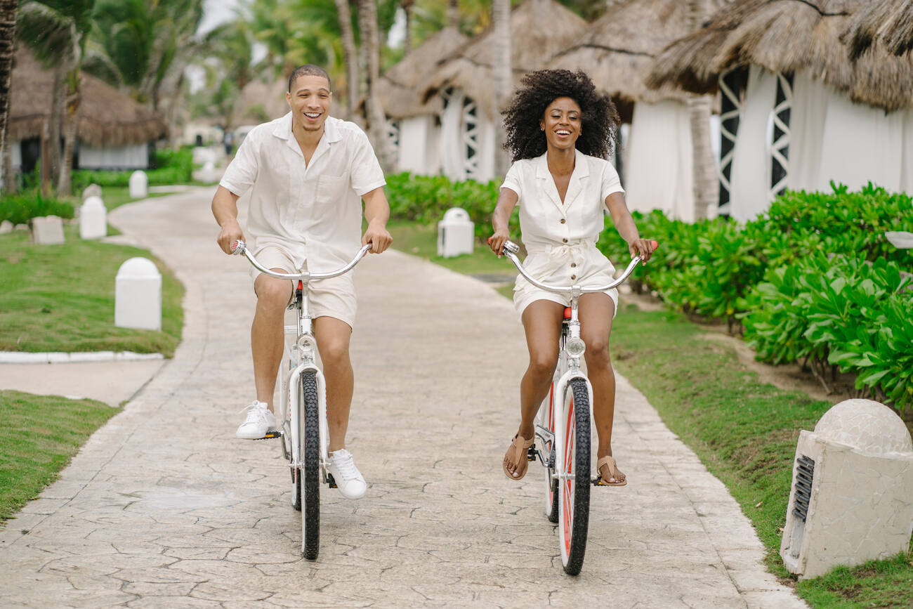 Two people riding bikes
