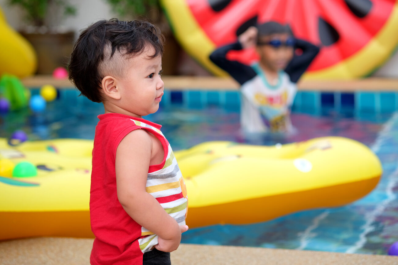 Kids playing at a pool