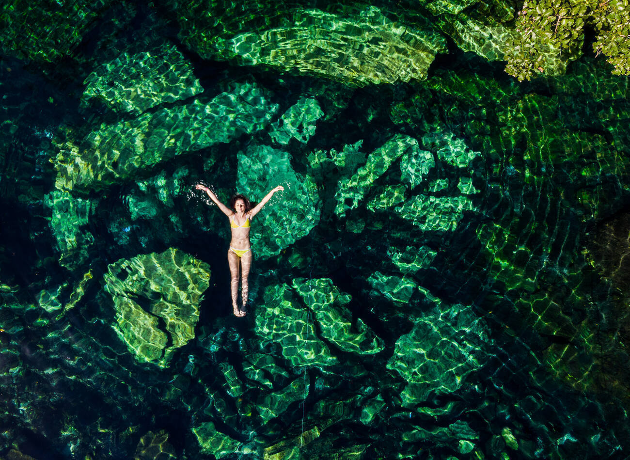 Woman floating on her back in the water