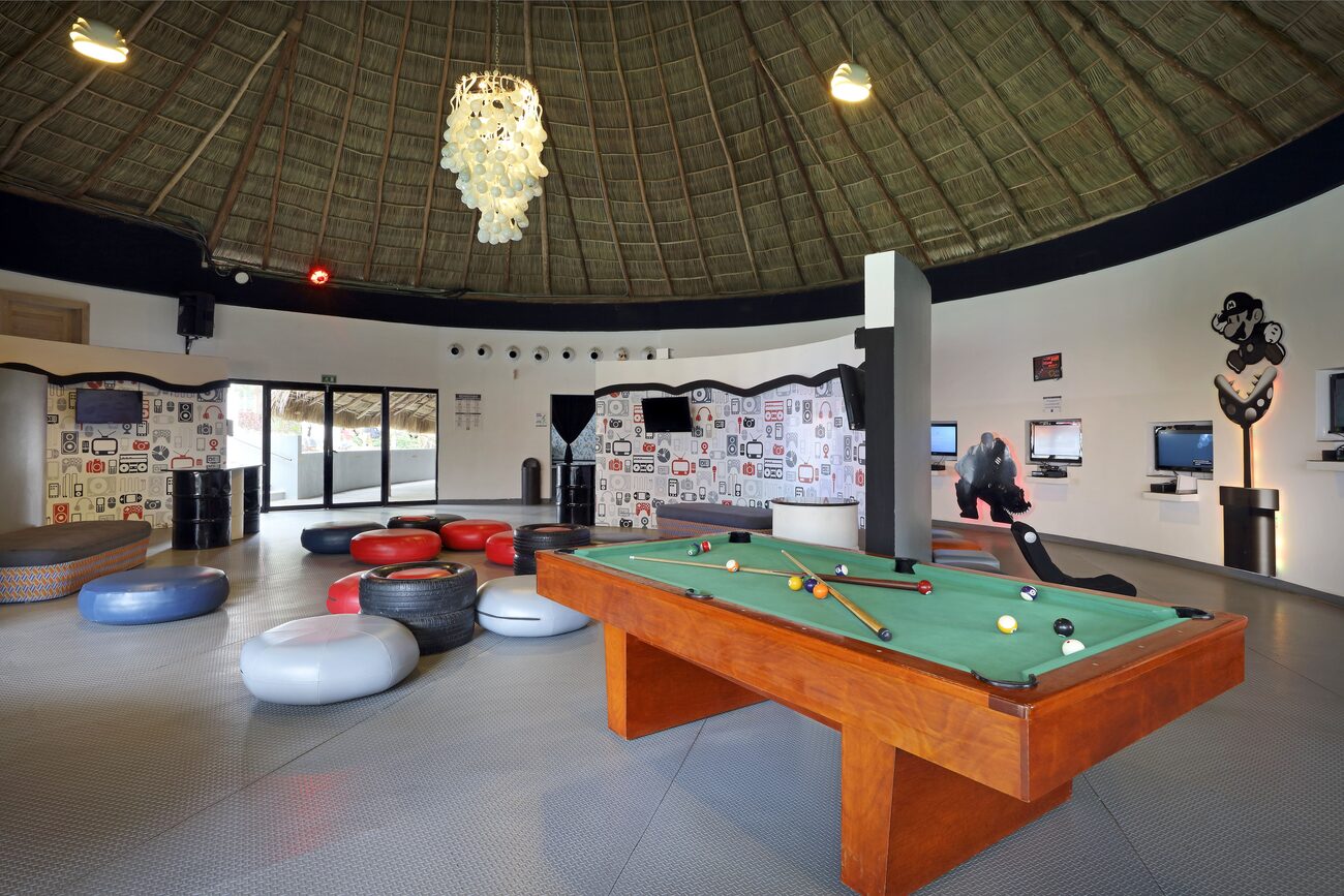 Room with pool table and gaming systems