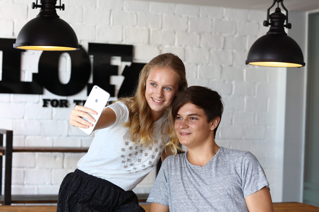 Boy and girl taking a selfie