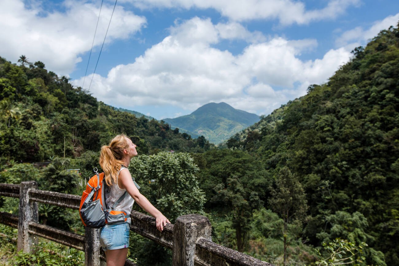 Woman on a hike overlooking the mountains