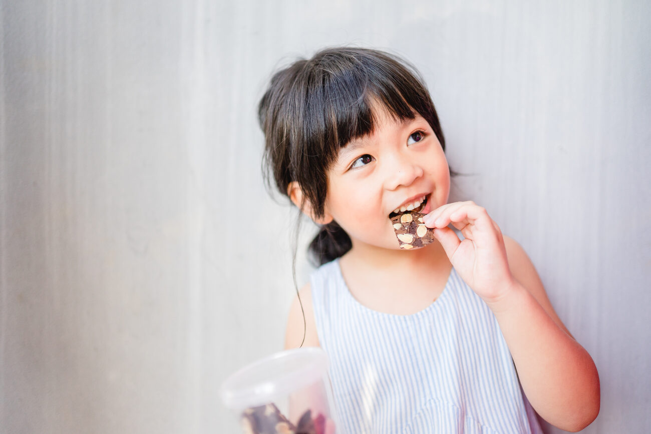 Young girl having a snack