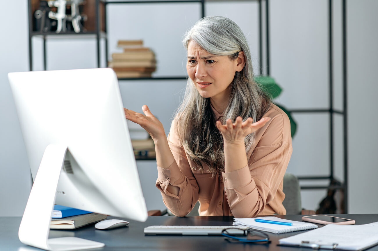 Confused gray-haired woman