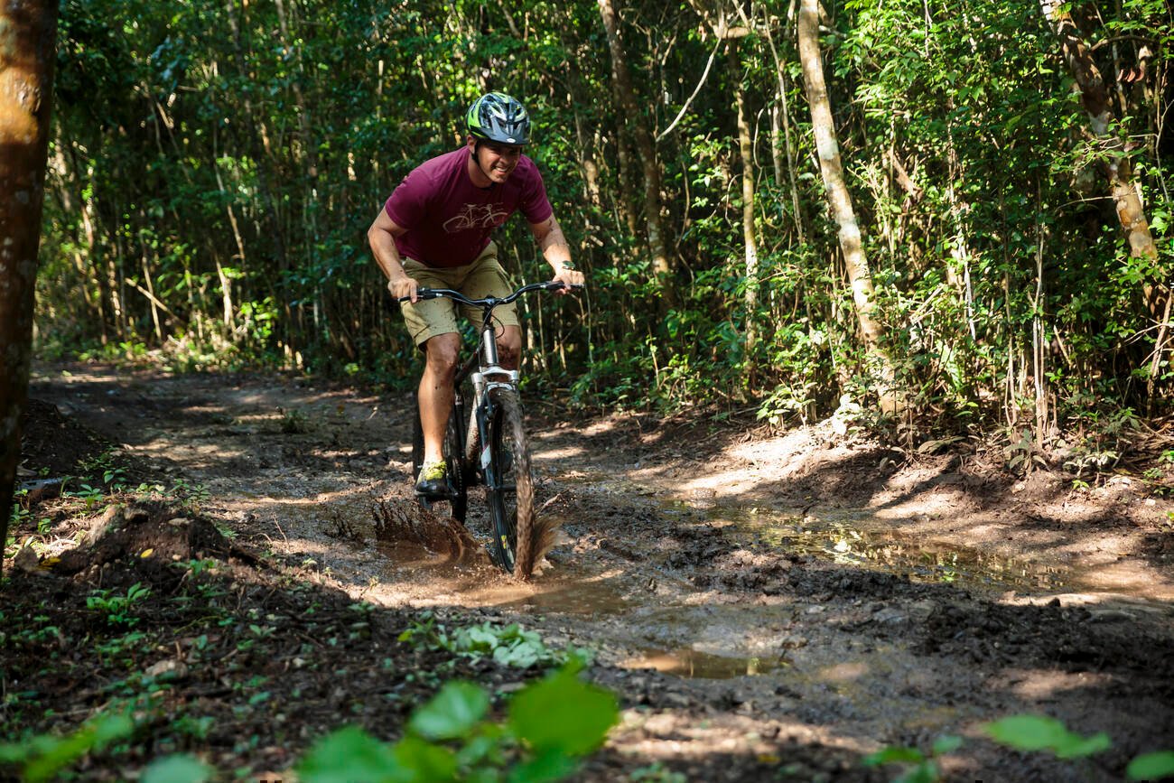 Man riding a bike on a trail