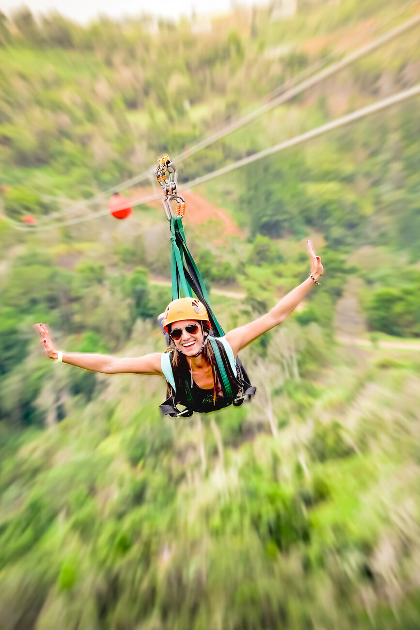 Woman zip lining 