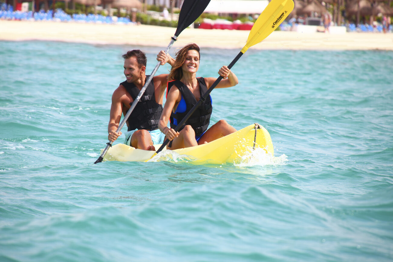 Two people kayaking in the ocean