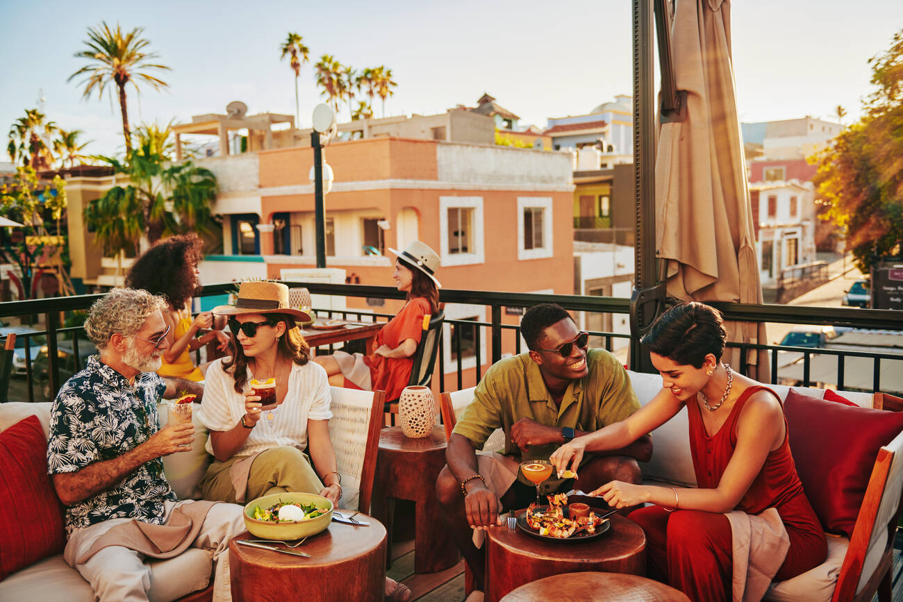 Group dining on a balcony 