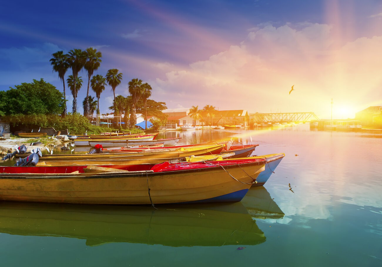 Sun shining over boats on the water