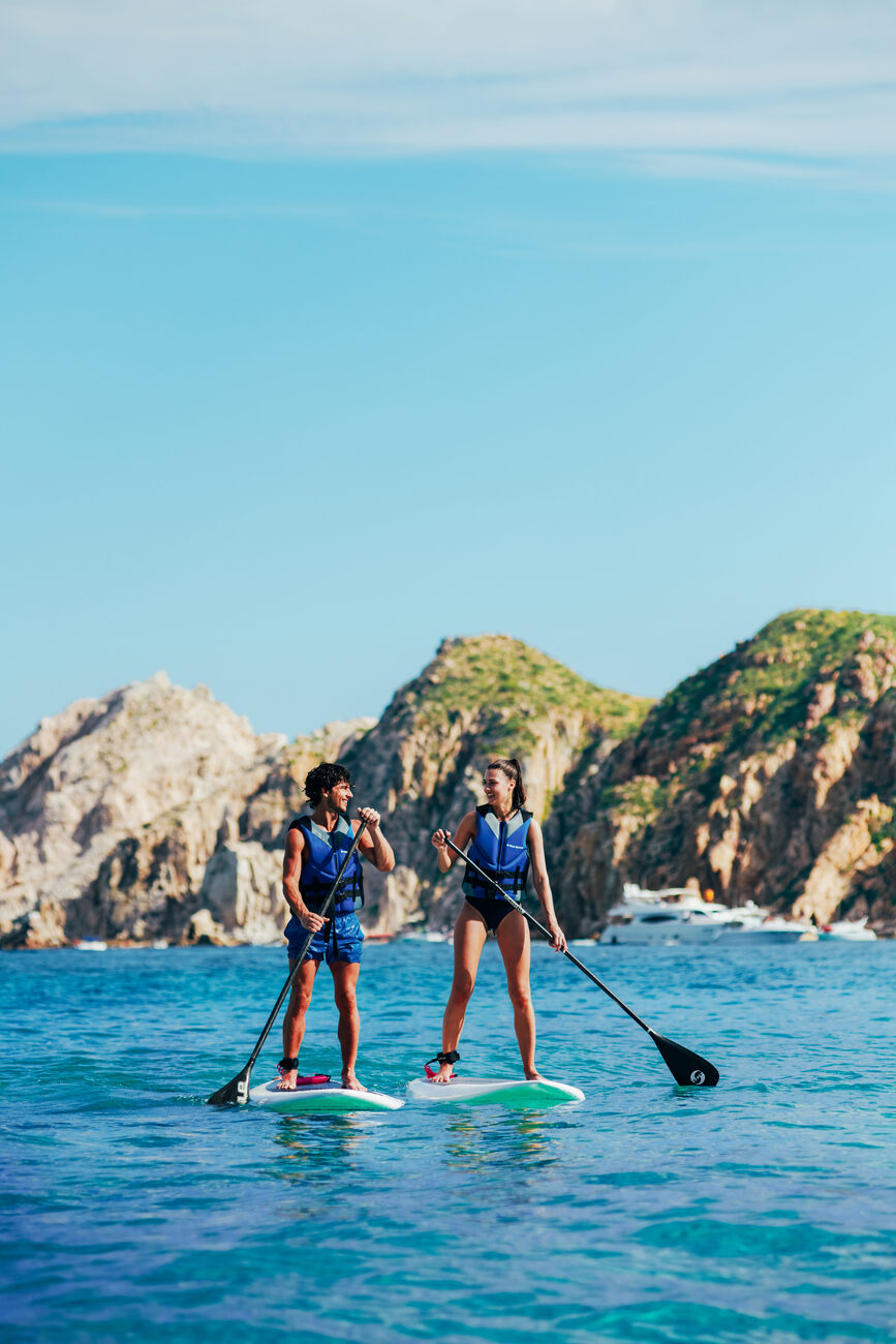 Two people paddle boarding 