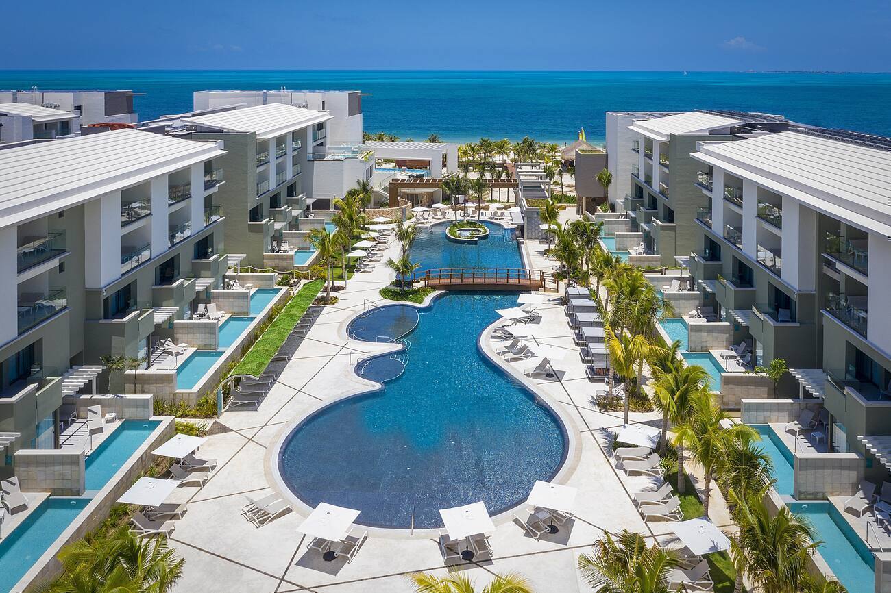 View of resort and pools with the ocean in the back