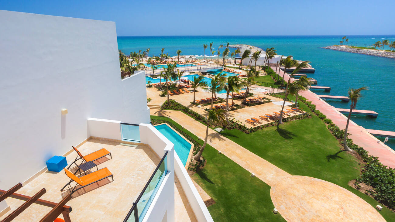 Balcony view of resort pools and ocean