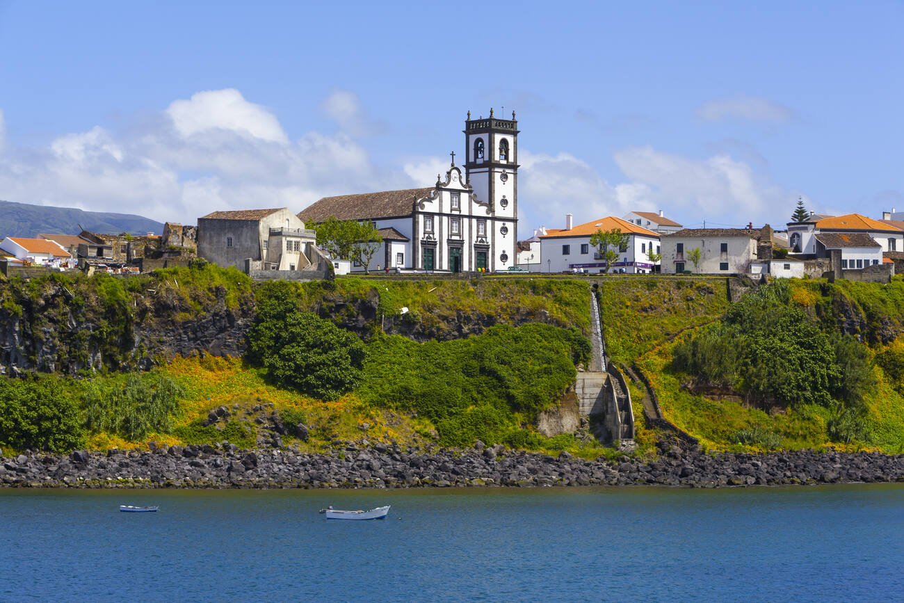 Buildings on a cliff overlooking the ocean